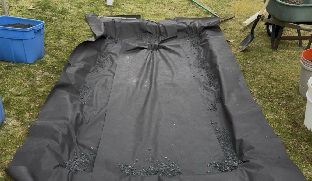 Add weed prevention landscaping fabric below your putting green rock base