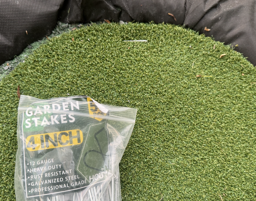 Add landscaping around the edges of the turf to keep it secure